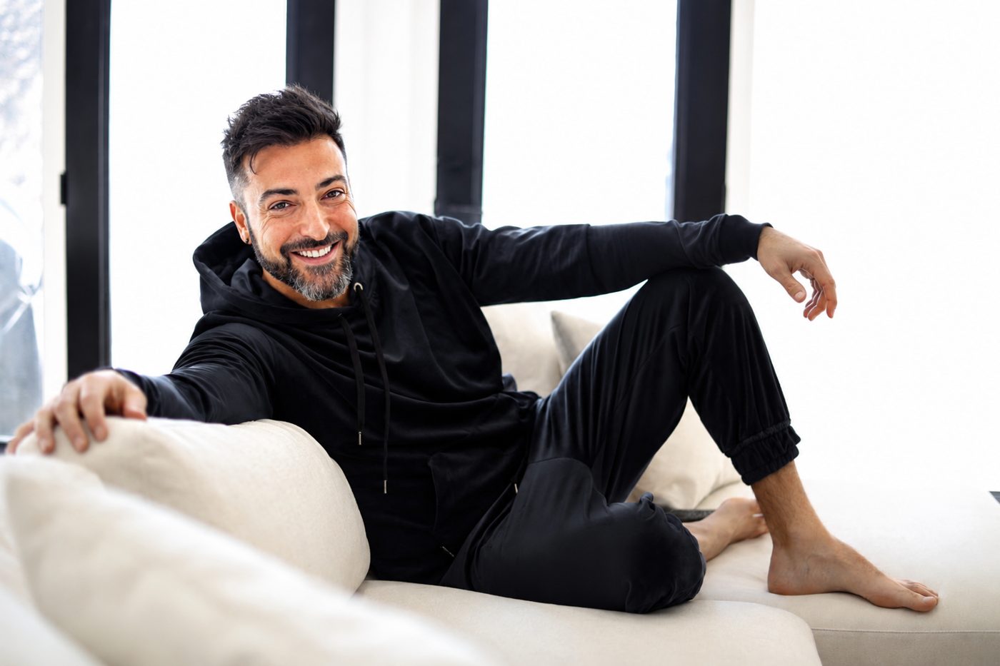 Joseph Tito at home on the couch — author of The Dad Diaries